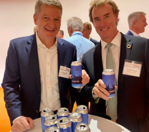 Two men smiling and enjoying Epic's OneWater Brew at the Sciens Rethinking Water Conference