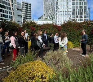 A group touring Epic Cleantec's onsite office garden