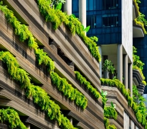 image of building with green landscaping cascading over the balconies